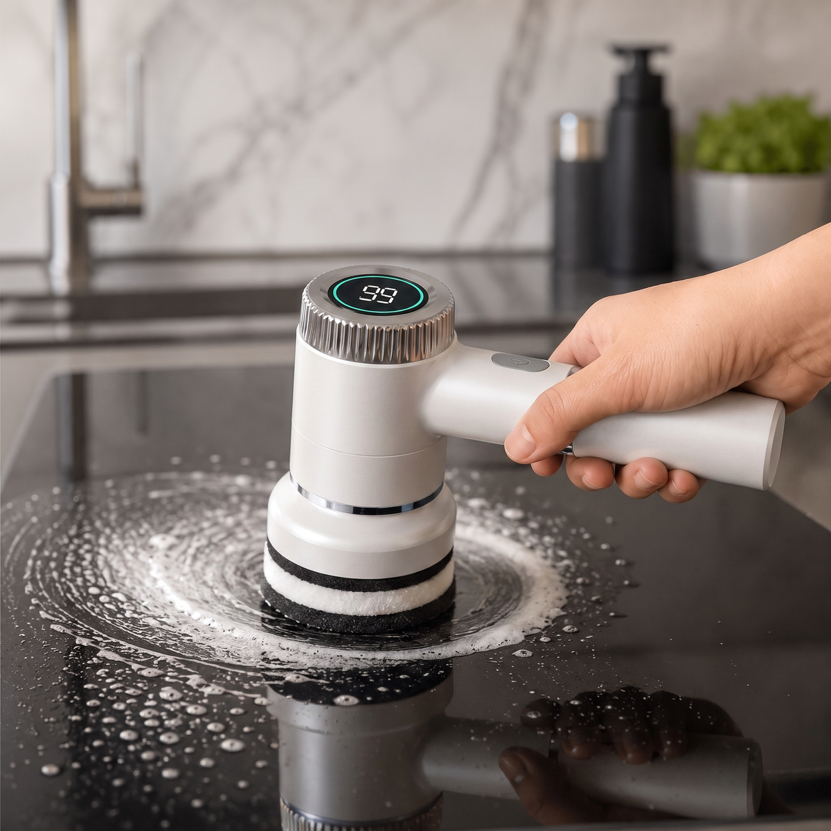 GleamSway SpinEase power scrubber in white, cleaning a black glass cooktop